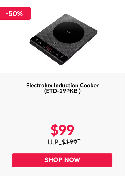 Man in a gray blazer over a dark gray shirt standing on stairs in an urban background.