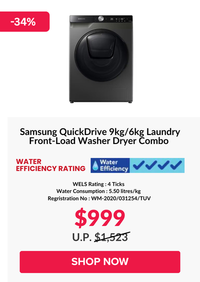 Woman wearing an olive green blazer and light blue jeans walking in an urban setting.