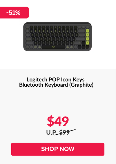 Woman wearing an olive green blazer and light blue jeans walking in an urban setting.