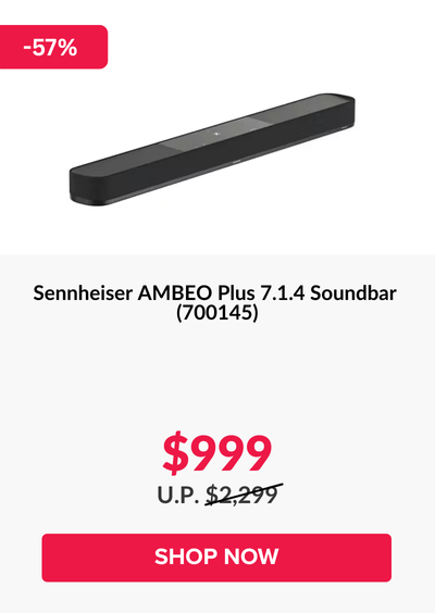 Woman wearing an olive green blazer and light blue jeans walking in an urban setting.