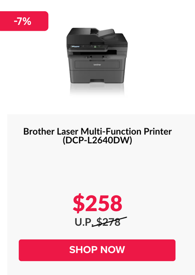 Woman wearing an olive green blazer and light blue jeans walking in an urban setting.