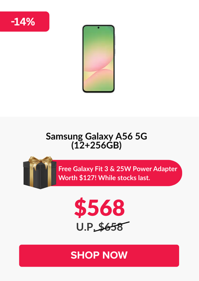 Man in a gray blazer over a dark gray shirt standing on stairs in an urban background.