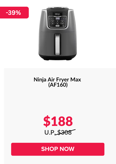 Woman wearing an olive green blazer and light blue jeans walking in an urban setting.