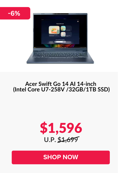 Man in a gray blazer over a dark gray shirt standing on stairs in an urban background.