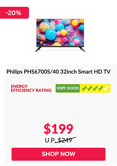 Man in a gray blazer over a dark gray shirt standing on stairs in an urban background.