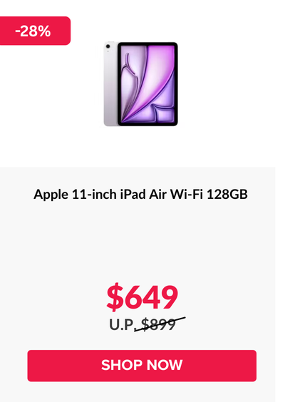 Woman wearing an olive green blazer and light blue jeans walking in an urban setting.