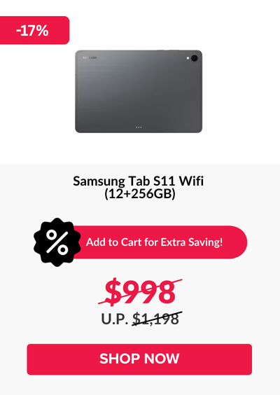 Man in a gray blazer over a dark gray shirt standing on stairs in an urban background.