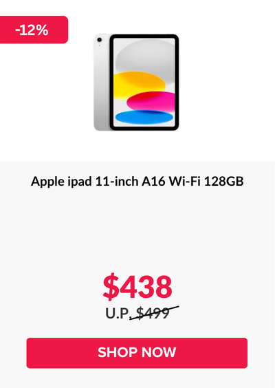 Woman wearing an olive green blazer and light blue jeans walking in an urban setting.