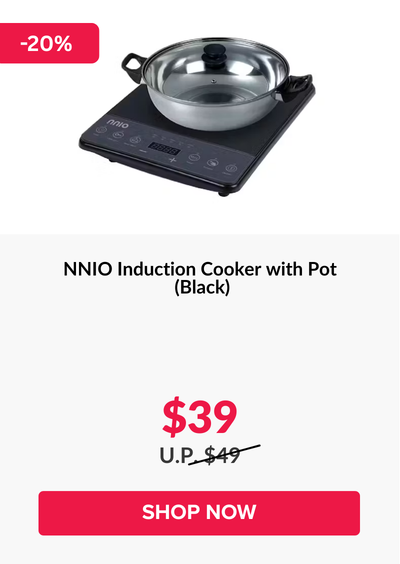 Man in a gray blazer over a dark gray shirt standing on stairs in an urban background.