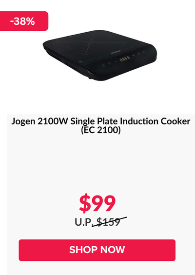 Woman wearing an olive green blazer and light blue jeans walking in an urban setting.