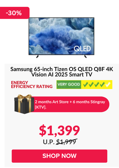 Man in a gray blazer over a dark gray shirt standing on stairs in an urban background.