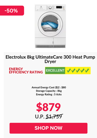 Woman wearing an olive green blazer and light blue jeans walking in an urban setting.