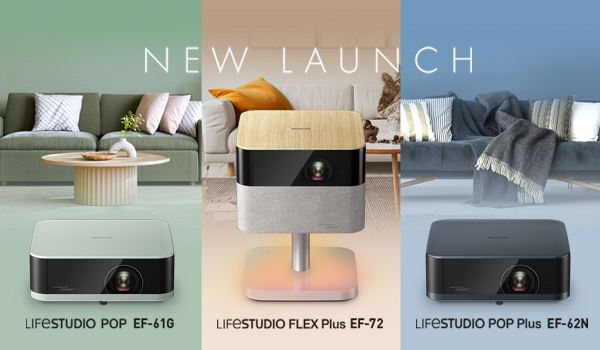 Three women enjoying a shopping day, carrying multiple colorful shopping bags while walking together outdoors.