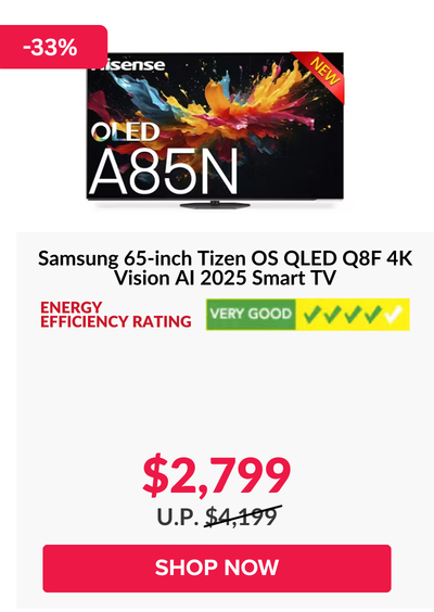 Man in a gray blazer over a dark gray shirt standing on stairs in an urban background.