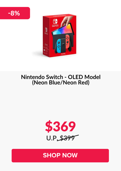 Woman wearing an olive green blazer and light blue jeans walking in an urban setting.