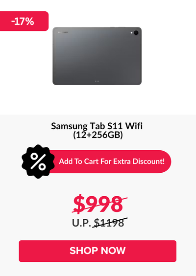 Man in a gray blazer over a dark gray shirt standing on stairs in an urban background.