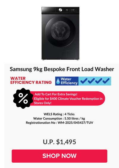 Woman wearing an olive green blazer and light blue jeans walking in an urban setting.