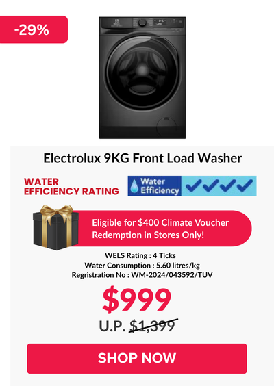 Woman wearing an olive green blazer and light blue jeans walking in an urban setting.