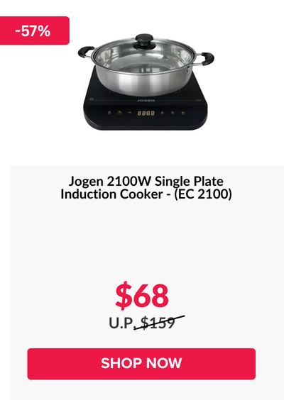 Woman wearing an olive green blazer and light blue jeans walking in an urban setting.