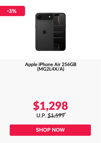 Woman wearing an olive green blazer and light blue jeans walking in an urban setting.