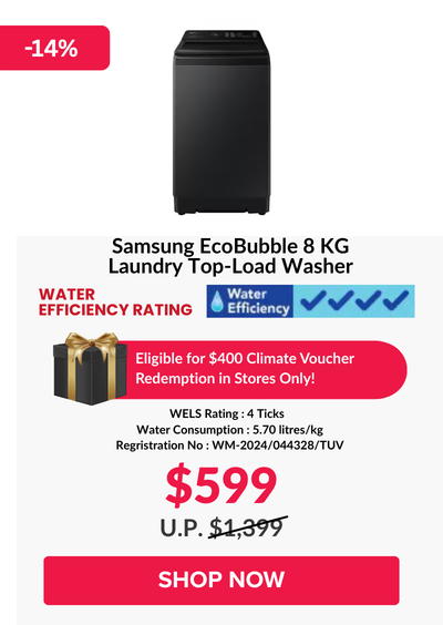 Woman wearing an olive green blazer and light blue jeans walking in an urban setting.