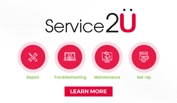 Woman wearing an olive green blazer and light blue jeans walking in an urban setting.