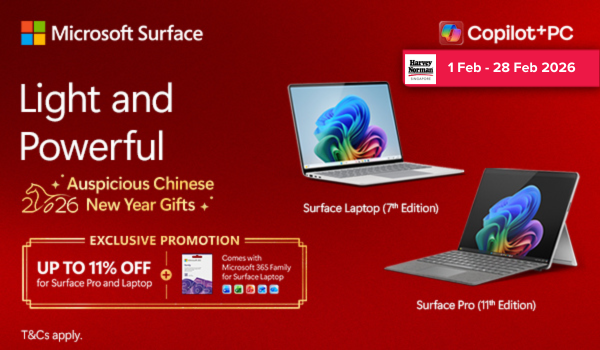 Woman wearing an olive green blazer and light blue jeans walking in an urban setting.