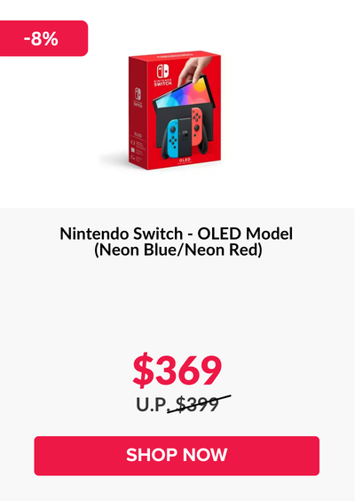 Woman wearing an olive green blazer and light blue jeans walking in an urban setting.