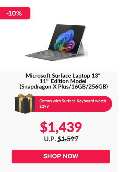 Man in a gray blazer over a dark gray shirt standing on stairs in an urban background.