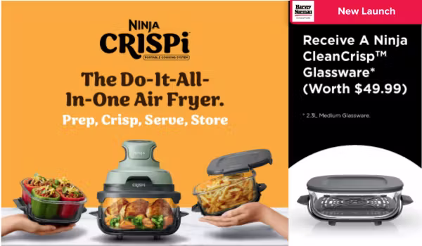 Man in a gray blazer over a dark gray shirt standing on stairs in an urban background.