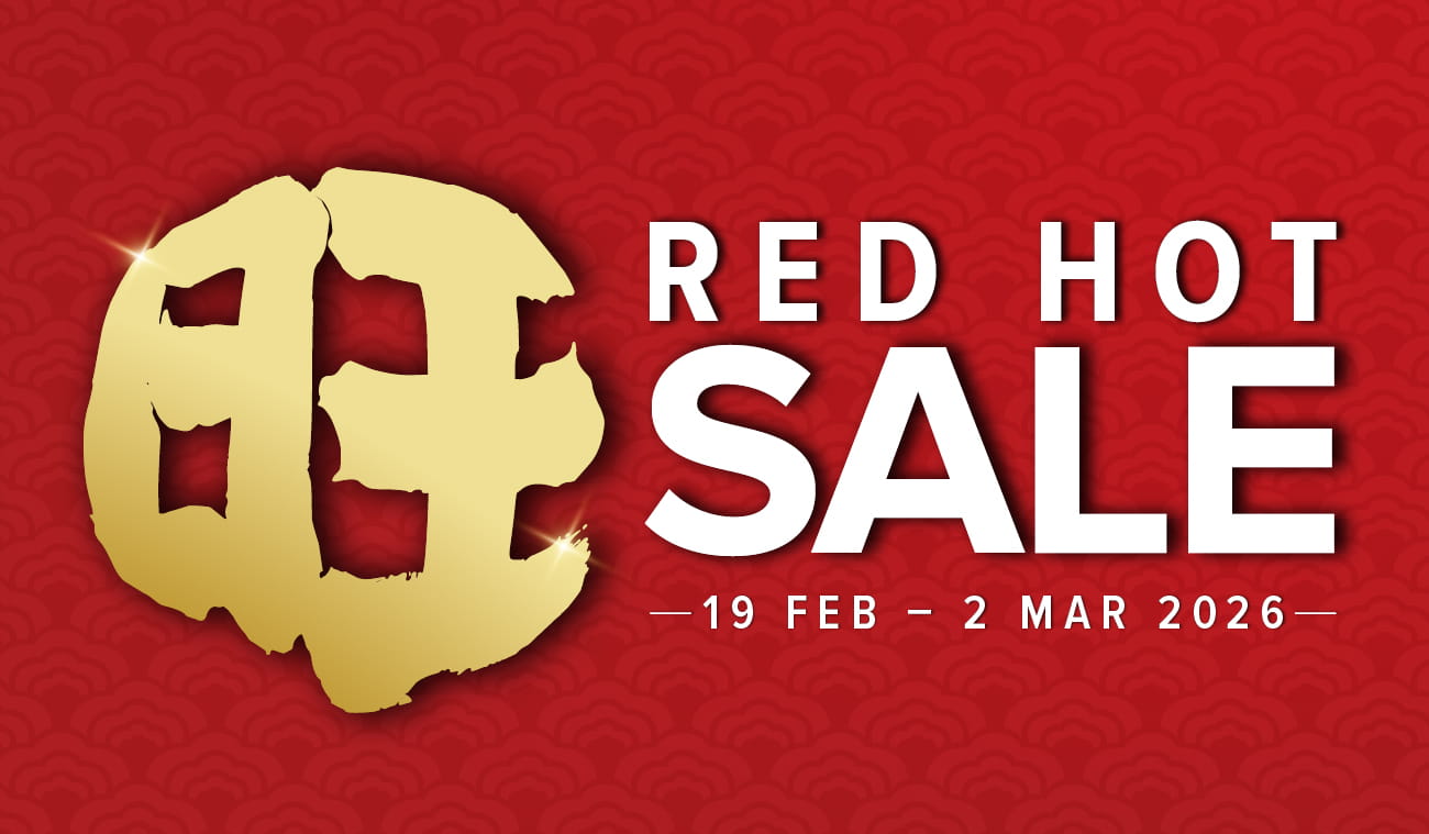 Three women enjoying a shopping day, carrying multiple colorful shopping bags while walking together outdoors.