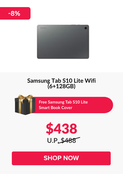 Man in a gray blazer over a dark gray shirt standing on stairs in an urban background.