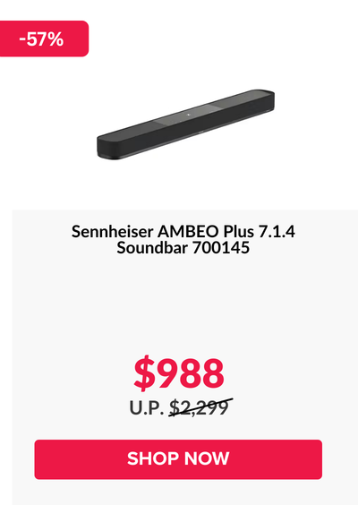 Woman wearing an olive green blazer and light blue jeans walking in an urban setting.