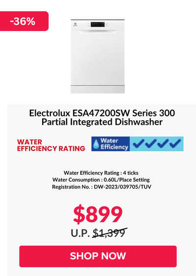 Woman wearing an olive green blazer and light blue jeans walking in an urban setting.