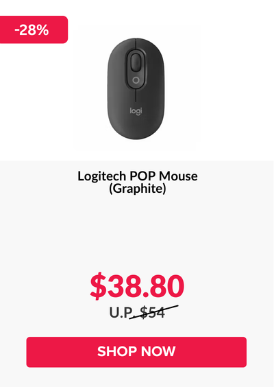 Woman wearing an olive green blazer and light blue jeans walking in an urban setting.