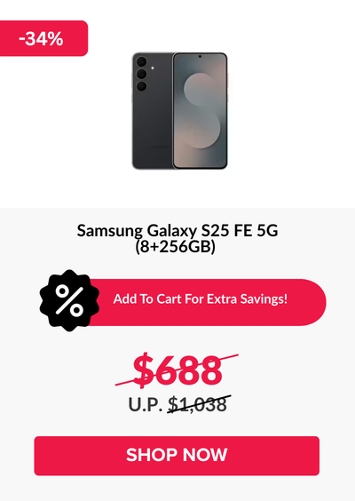 Man in a gray blazer over a dark gray shirt standing on stairs in an urban background.