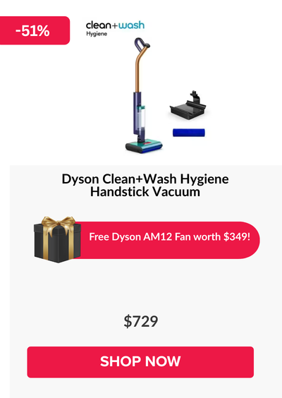 Woman wearing an olive green blazer and light blue jeans walking in an urban setting.