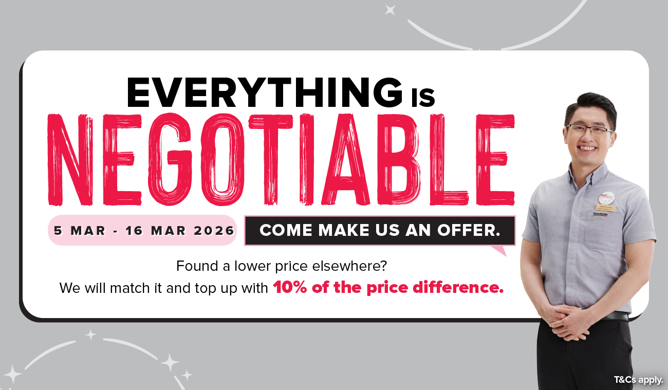 Three women enjoying a shopping day, carrying multiple colorful shopping bags while walking together outdoors.