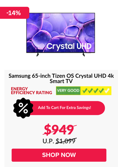 Man in a gray blazer over a dark gray shirt standing on stairs in an urban background.