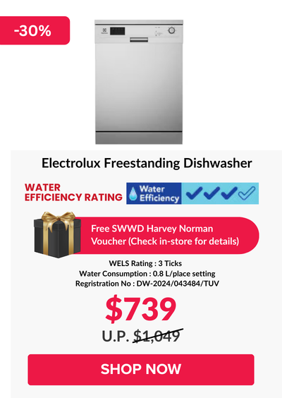 Woman wearing an olive green blazer and light blue jeans walking in an urban setting.