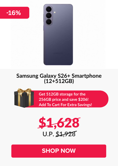 Man in a gray blazer over a dark gray shirt standing on stairs in an urban background.