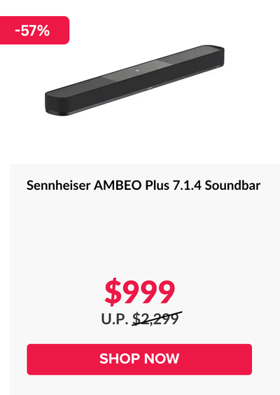 Woman wearing an olive green blazer and light blue jeans walking in an urban setting.