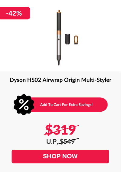 Man in a gray blazer over a dark gray shirt standing on stairs in an urban background.