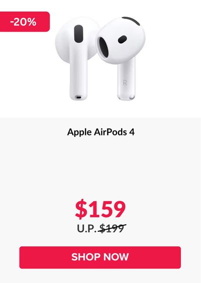 Woman wearing an olive green blazer and light blue jeans walking in an urban setting.