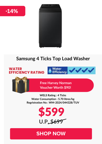 Woman wearing an olive green blazer and light blue jeans walking in an urban setting.