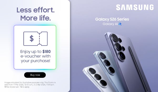 Woman wearing an olive green blazer and light blue jeans walking in an urban setting.