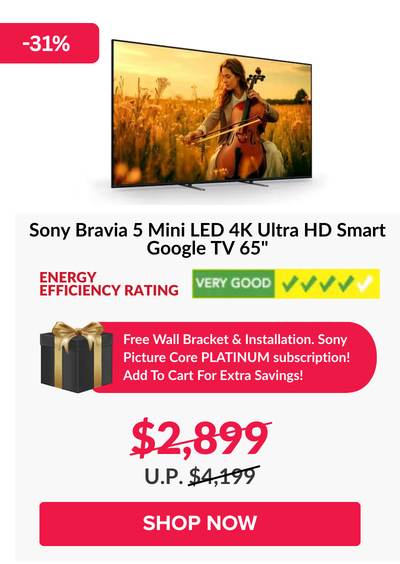 Man in a gray blazer over a dark gray shirt standing on stairs in an urban background.