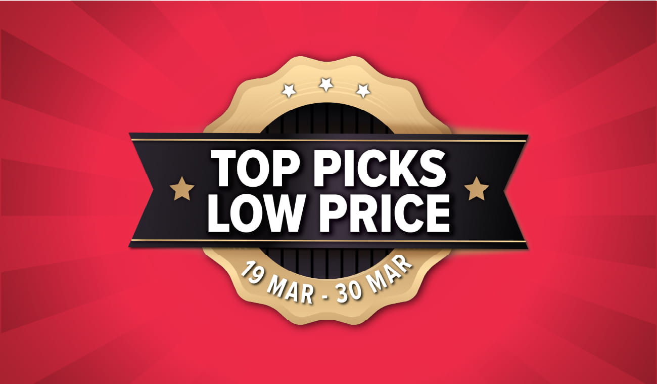 Three women enjoying a shopping day, carrying multiple colorful shopping bags while walking together outdoors.