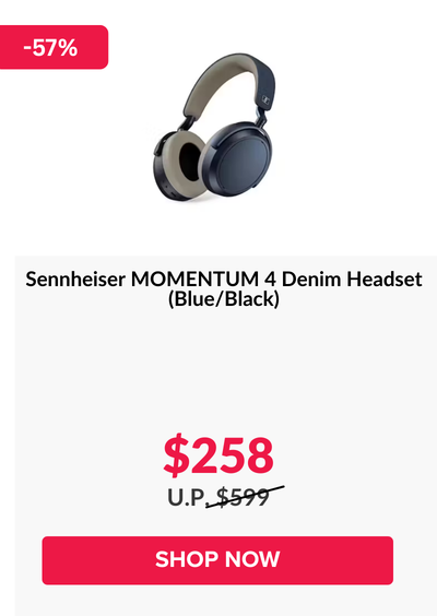 Woman wearing an olive green blazer and light blue jeans walking in an urban setting.