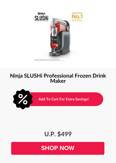 Woman wearing an olive green blazer and light blue jeans walking in an urban setting.